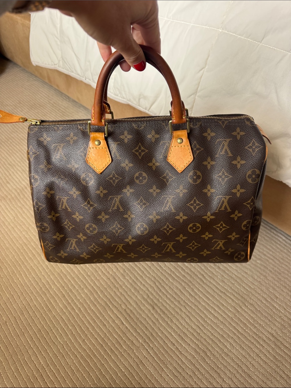 Authentic Louis Vuitton Monogram Canvas Speedy 35 Handbag in Brown and Tan.
